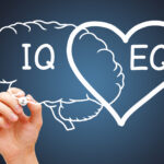 Hand drawing a heart and brain concept about the EQ emotional intelligence and IQ intelligence quotient.