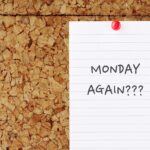 Note pin on cork board with handwriting MONDAY AGAIN? - worker feeling miserable, hate and dreaded Monday. Employees who work in toxic or unhappy workplace feeling Sunday Scaries