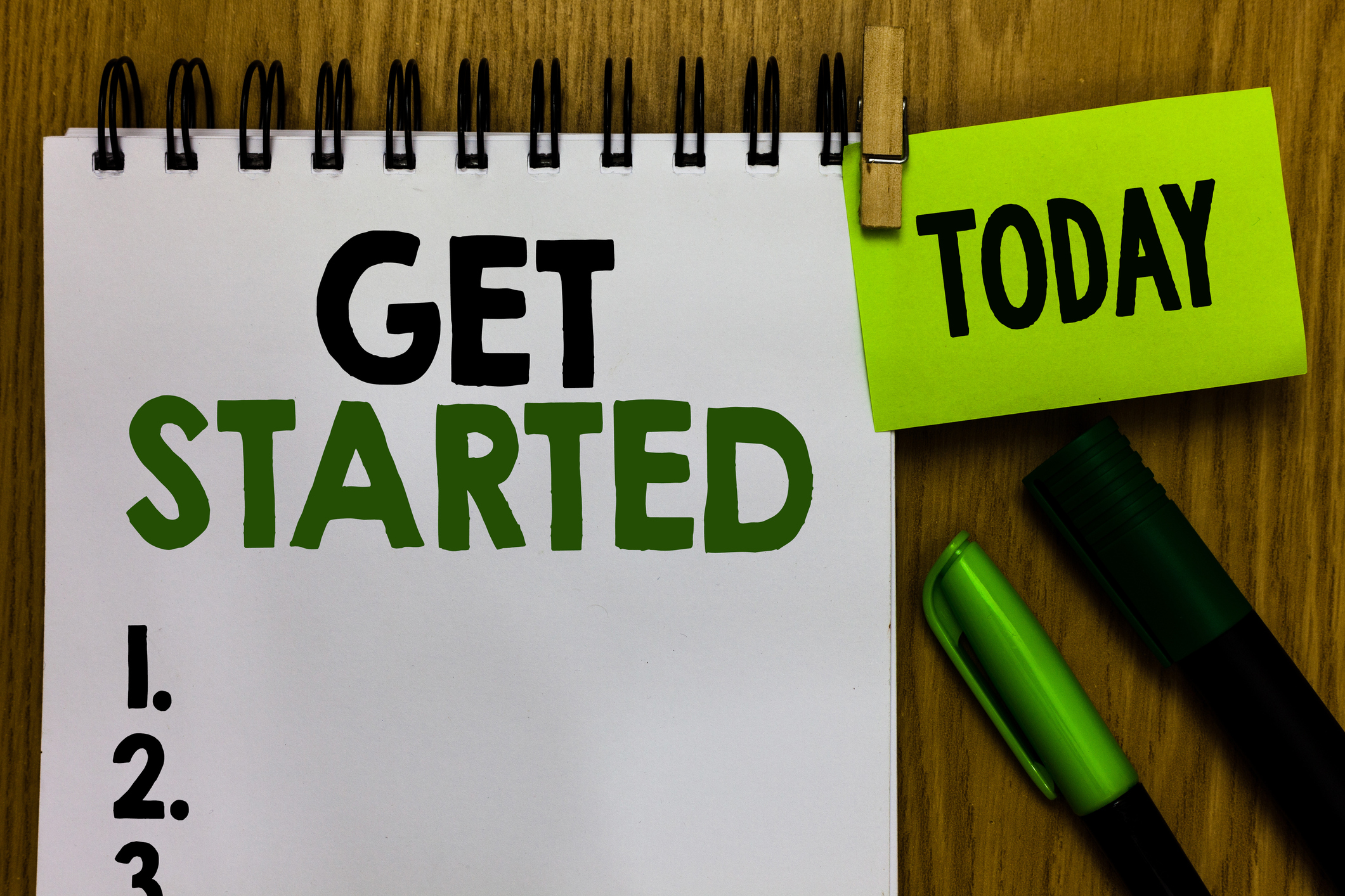 Text sign showing Get Started. Conceptual photo asking someone to begin task endeavour or process right now Notebook clothespin holding reminder markers expressing ideas wood table